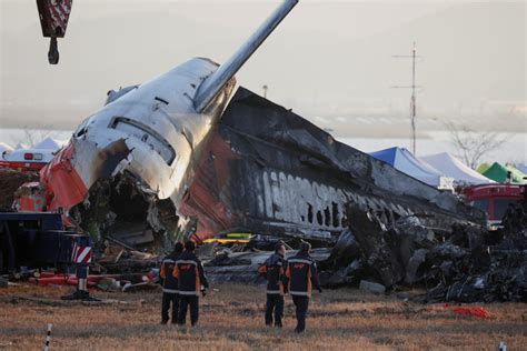 U S And Boeing Investigators Examine The Site Of Fatal South Korean Plane Crash Pbs News U S And Boeing Investigators Examine The Site Of Fatal South Korean Plane Crash Pbs News